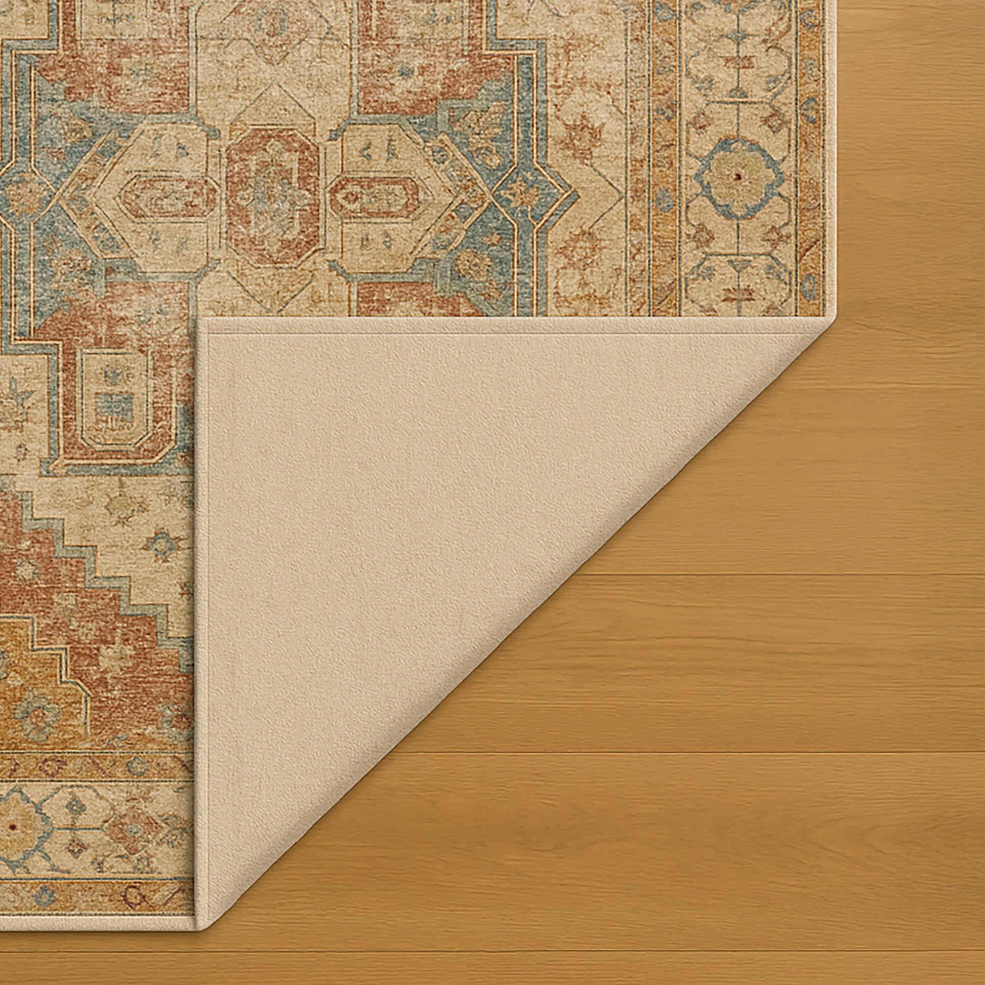 Patterned rug corner on a wooden floor
